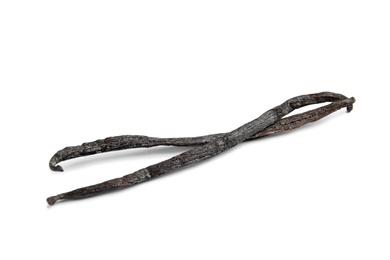 Photo of Dried aromatic vanilla sticks on white background