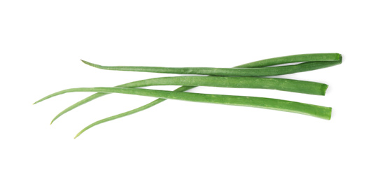 Photo of Fresh green spring onions isolated on white, top view