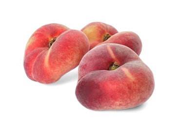 Photo of Fresh ripe donut peaches on white background