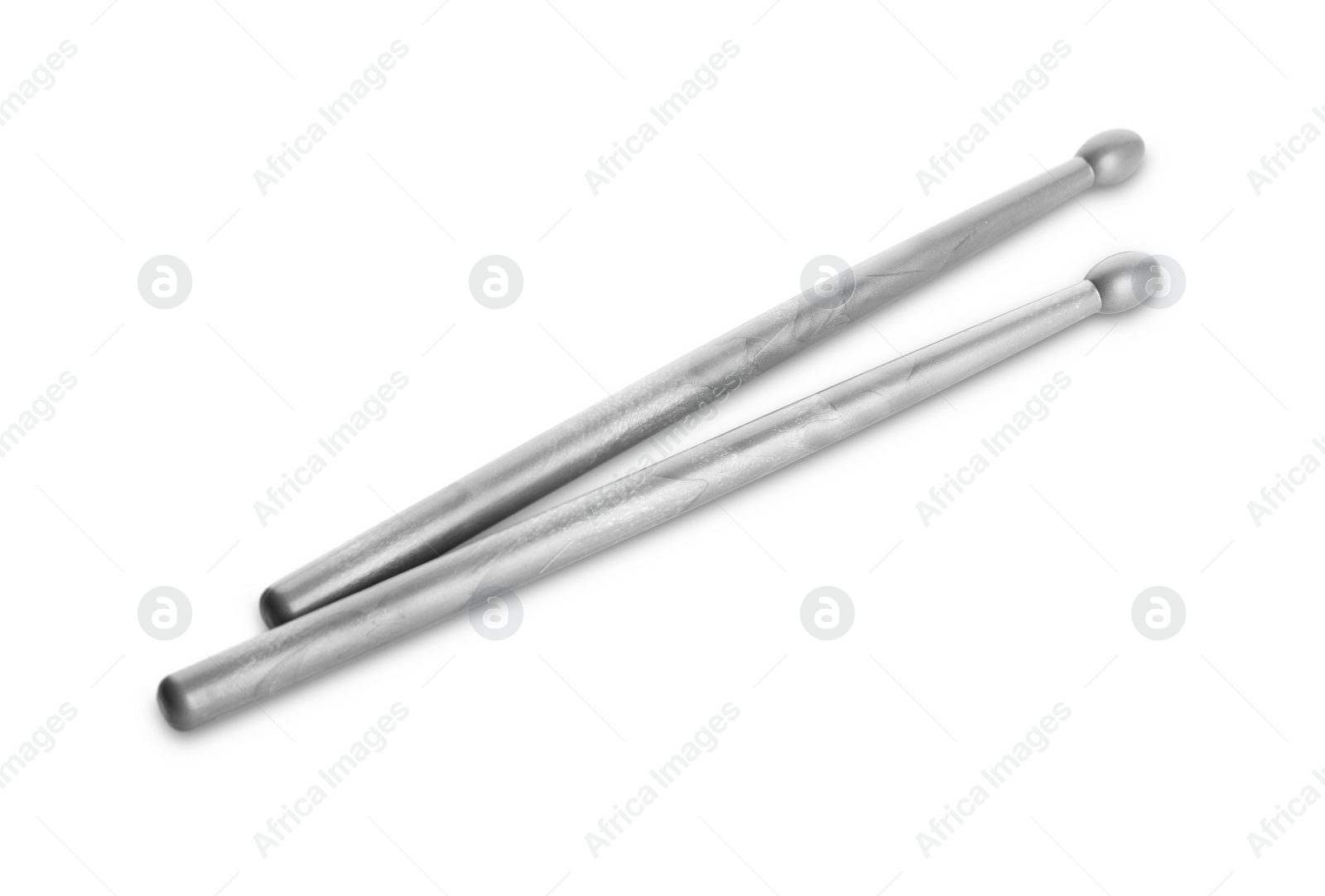 Photo of Two grey drum sticks isolated on white