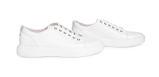 Photo of Pair of stylish sneakers isolated on white