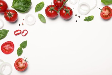 Photo of Composition with fresh basil leaves and tomatoes on white background, flat lay. Space for text