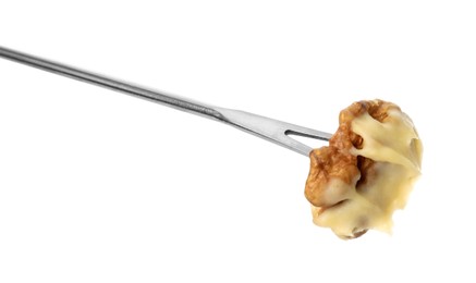 Photo of Tasty fondue. Fork with walnut and melted cheese isolated on white