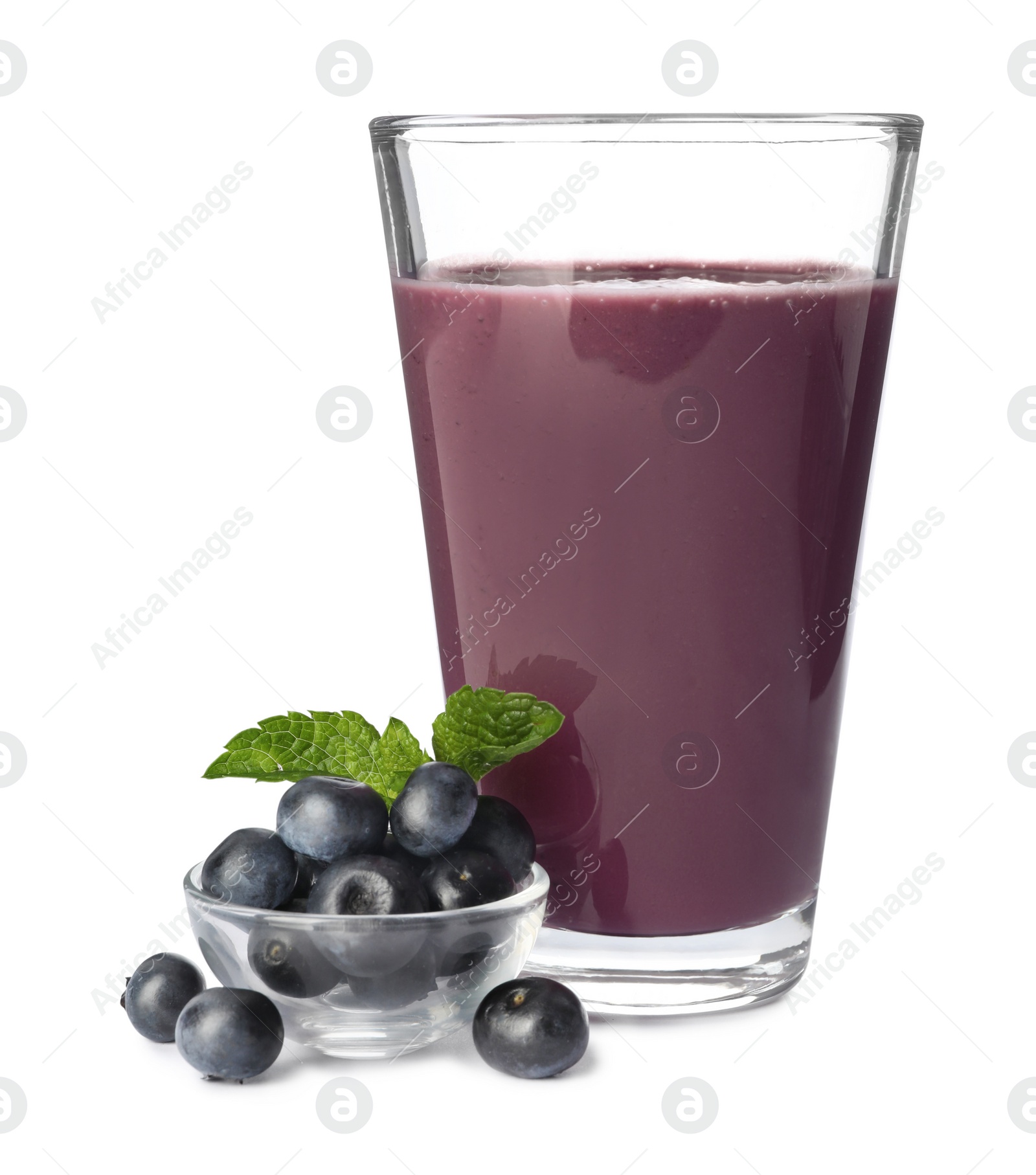 Photo of Glass of acai drink with berries on white background