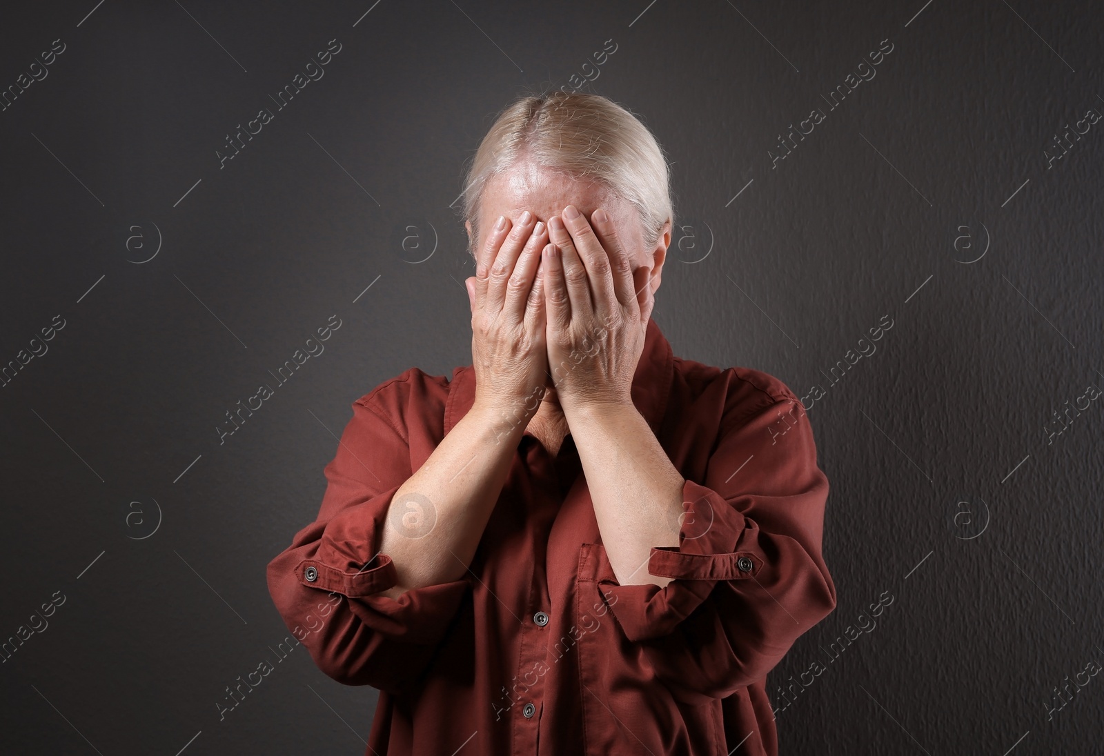 Photo of Mature woman suffering from depression on grey background