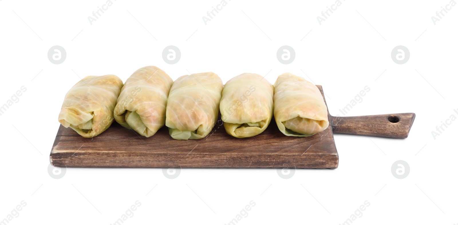 Photo of Wooden board with uncooked stuffed cabbage rolls on white background