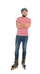 Photo of Full length portrait of young man with inline roller skates on white background