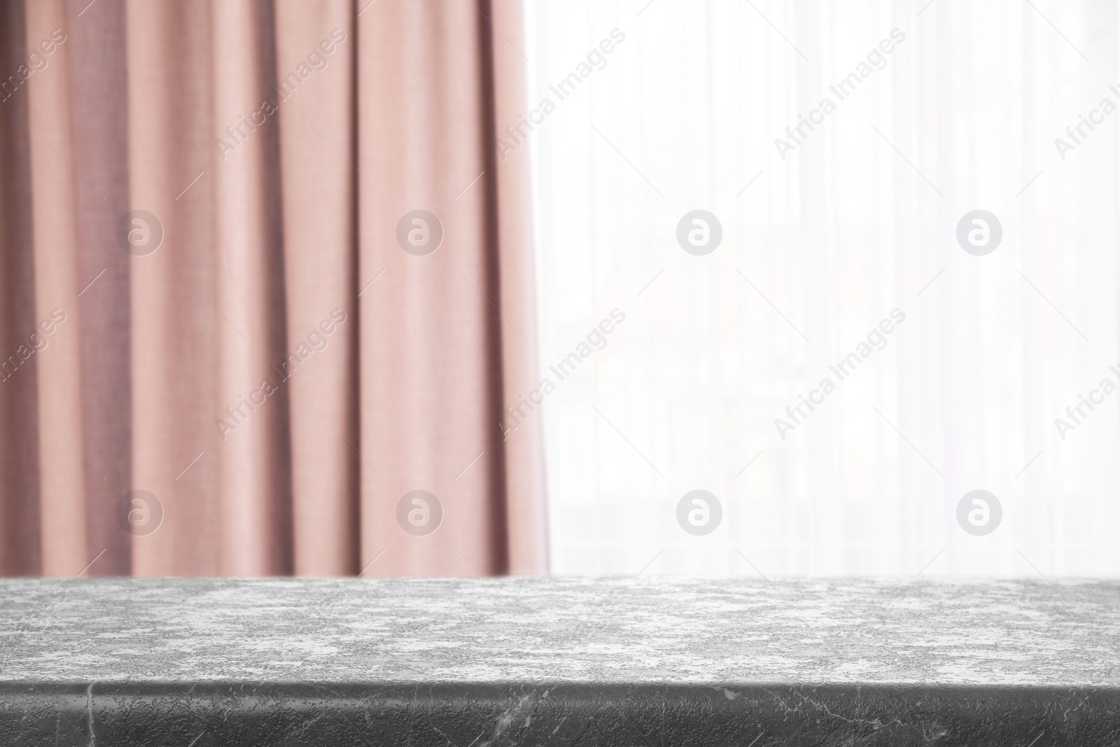 Image of Empty grey stone table in room. Space for design