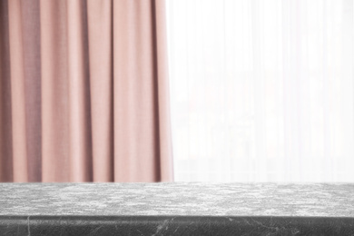 Image of Empty grey stone table in room. Space for design