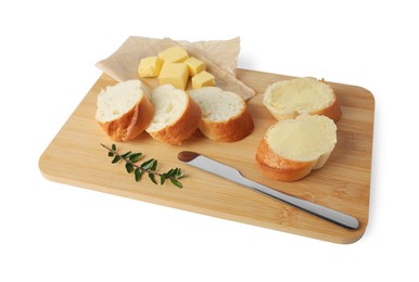 Photo of Wooden board with sliced baguette and fresh butter on white background