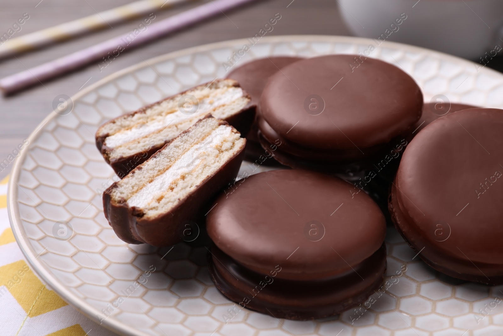 Photo of Tasty choco pies on plate, closeup view