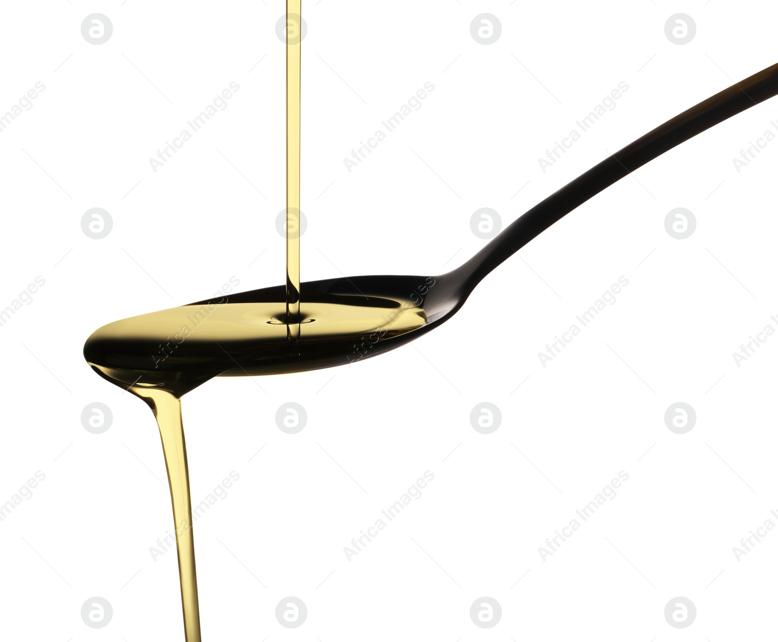 Photo of Pouring cooking oil into spoon on white background