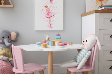 Photo of Children's room with modern furniture and picture. Interior design