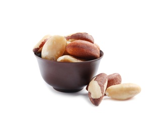 Bowl with Brazil nuts on white background