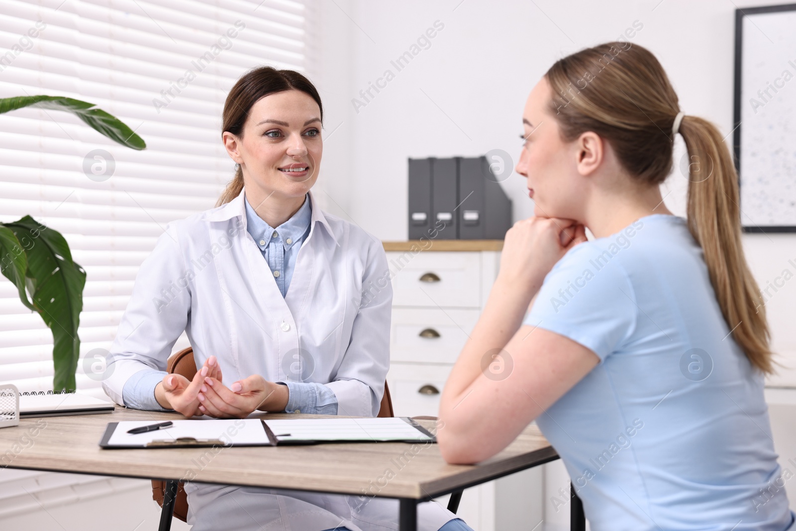 Photo of Mammologist consulting woman during appointment in hospital