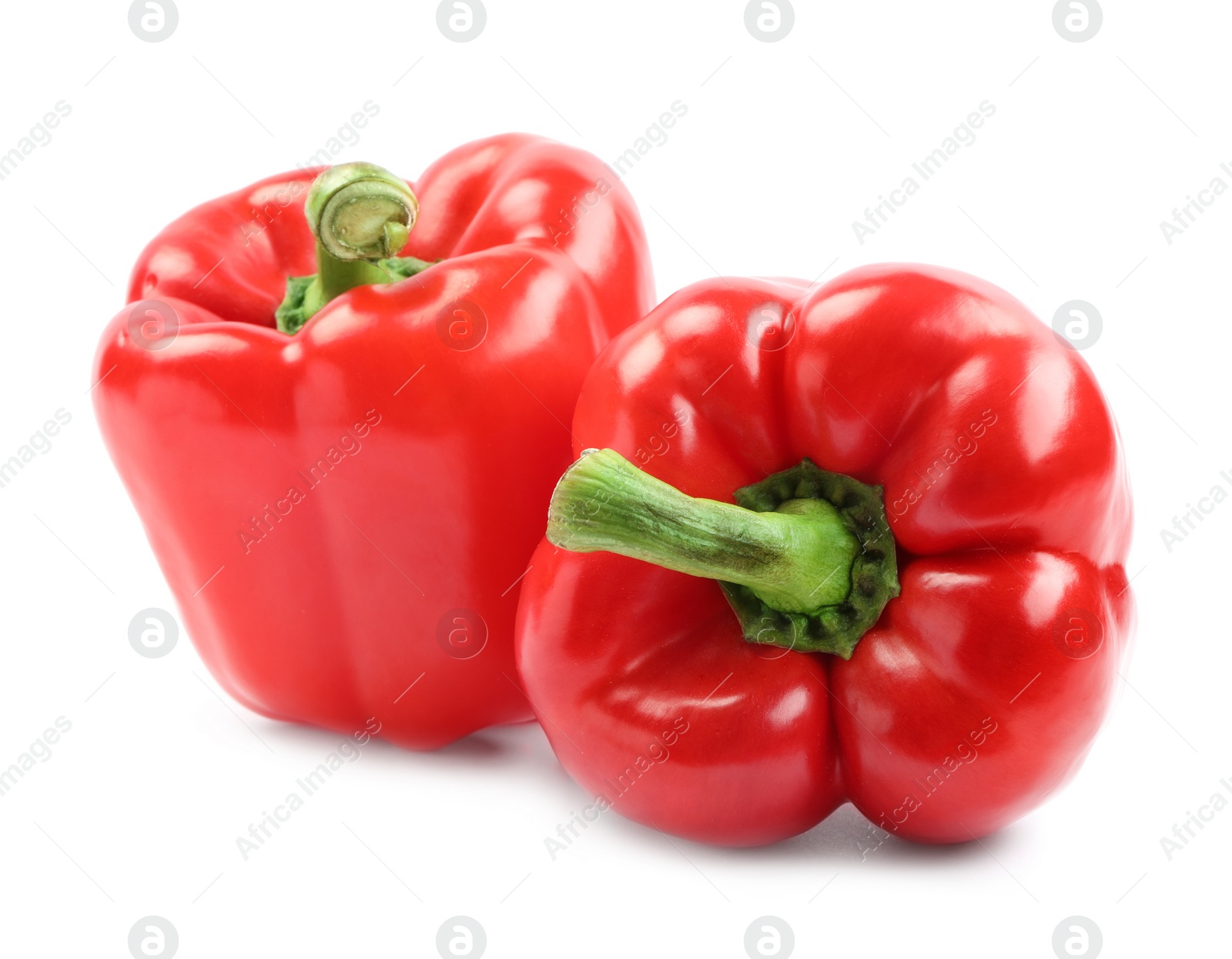 Photo of Ripe red bell peppers isolated on white