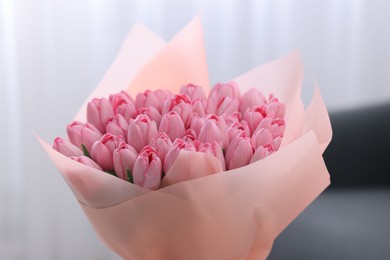 Photo of Bouquet of beautiful pink tulips indoors, closeup