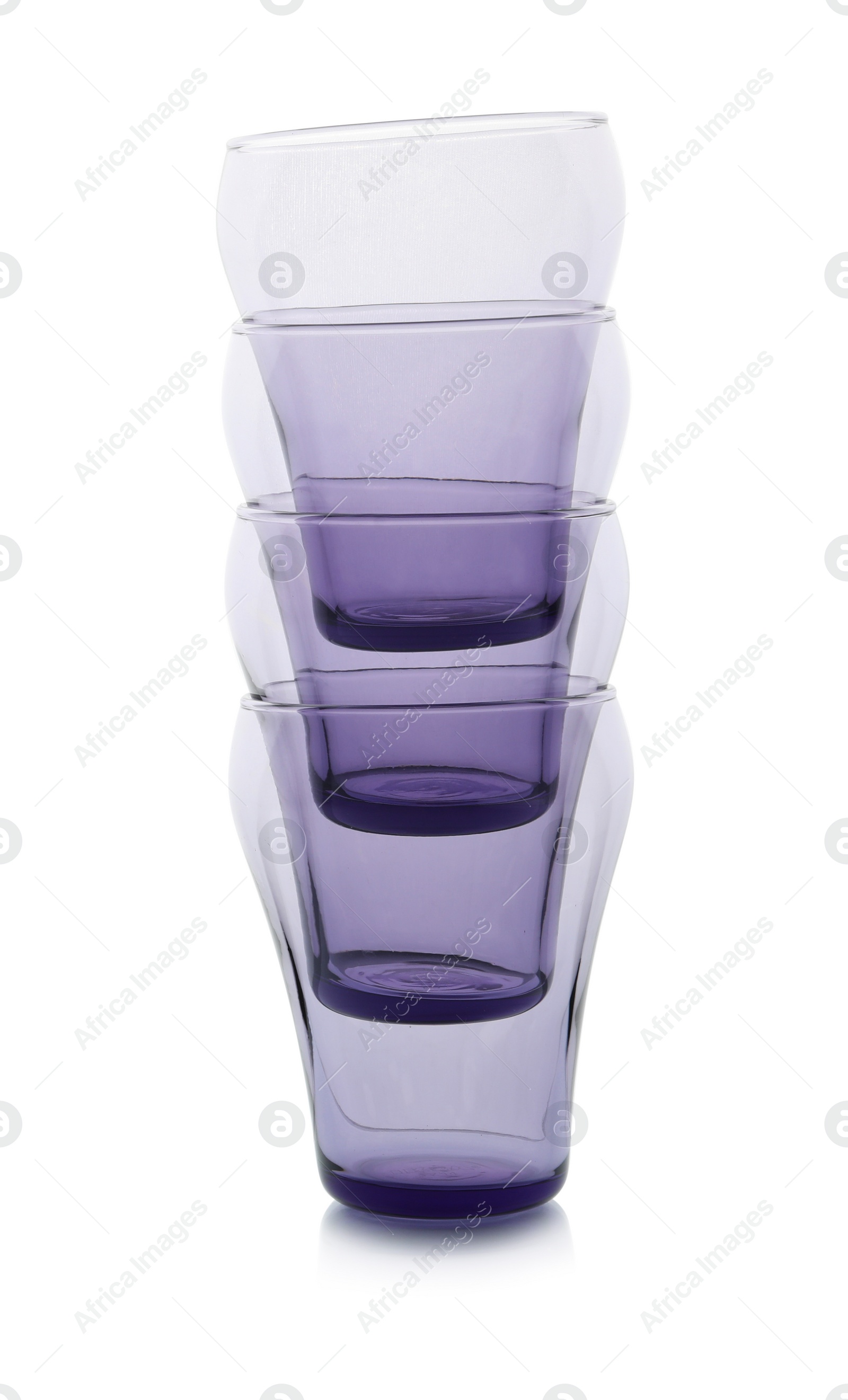 Photo of Stack of empty colorful glasses on white background