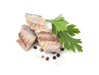 Photo of Delicious canned mackerel chunks with parsley and spices on white background, top view