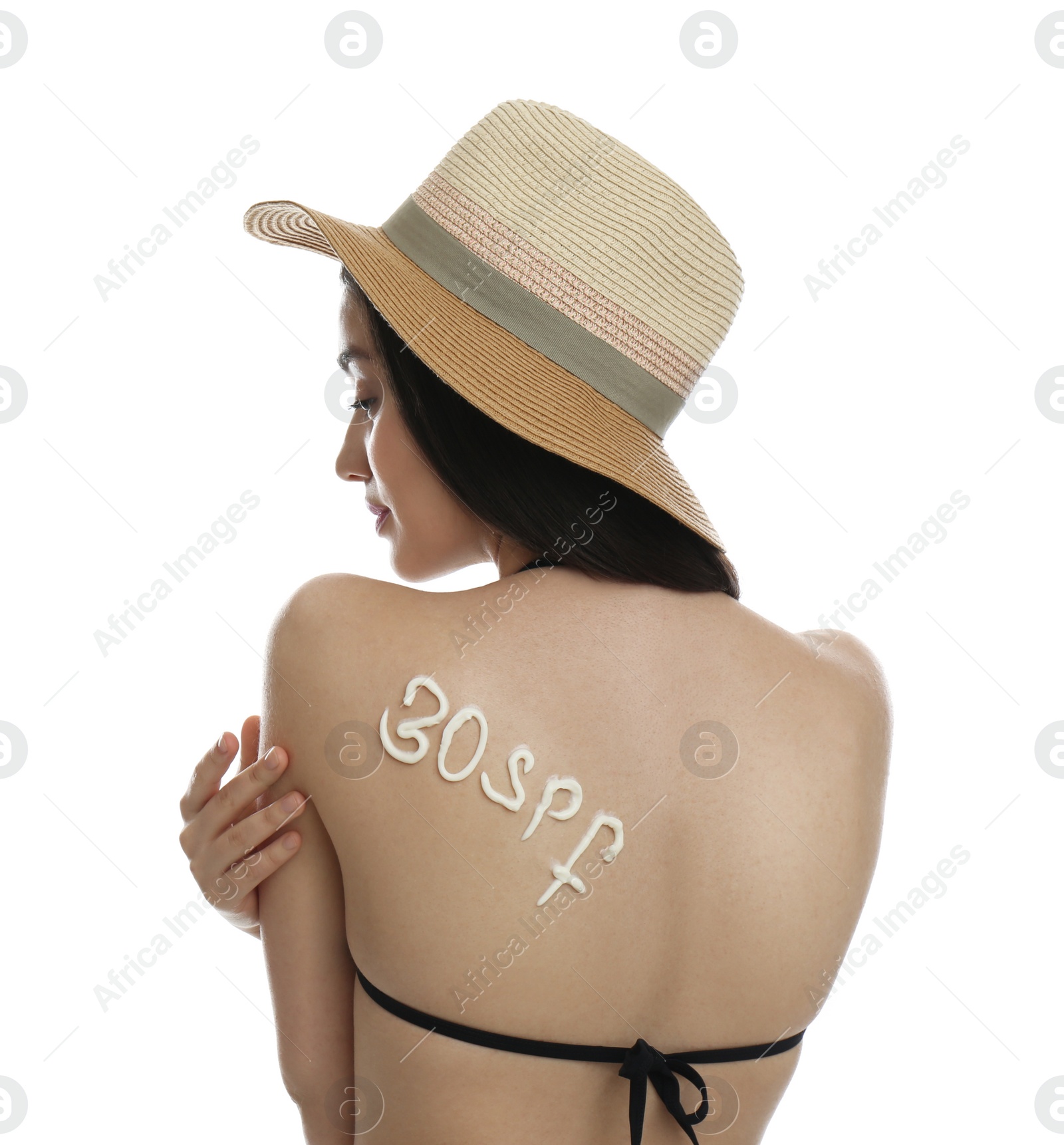 Photo of Text 30 SPF written with sun protection cream on woman's back against white background