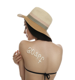 Photo of Text 30 SPF written with sun protection cream on woman's back against white background