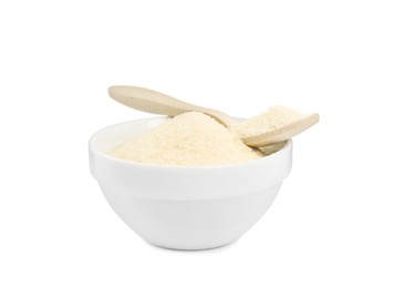 Photo of Gelatin powder in spoon and bowl isolated on white