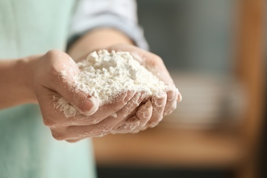 Photo of Woman holding flour, closeup