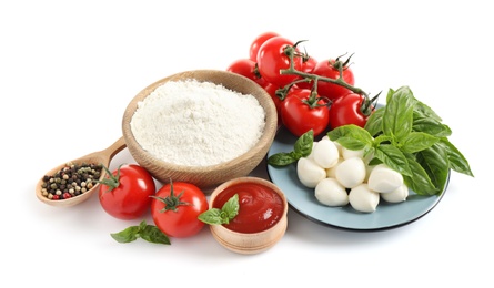 Photo of Fresh ingredients for pizza on white background