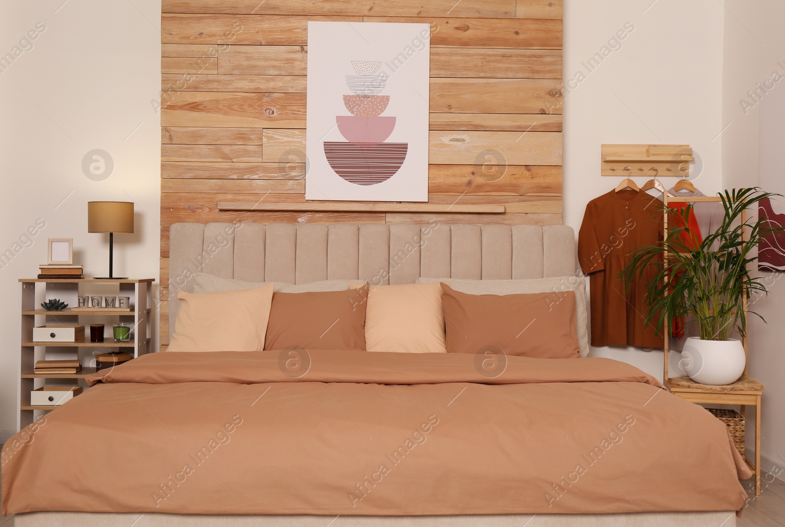 Photo of Comfortable bed with stylish linens. Interior design