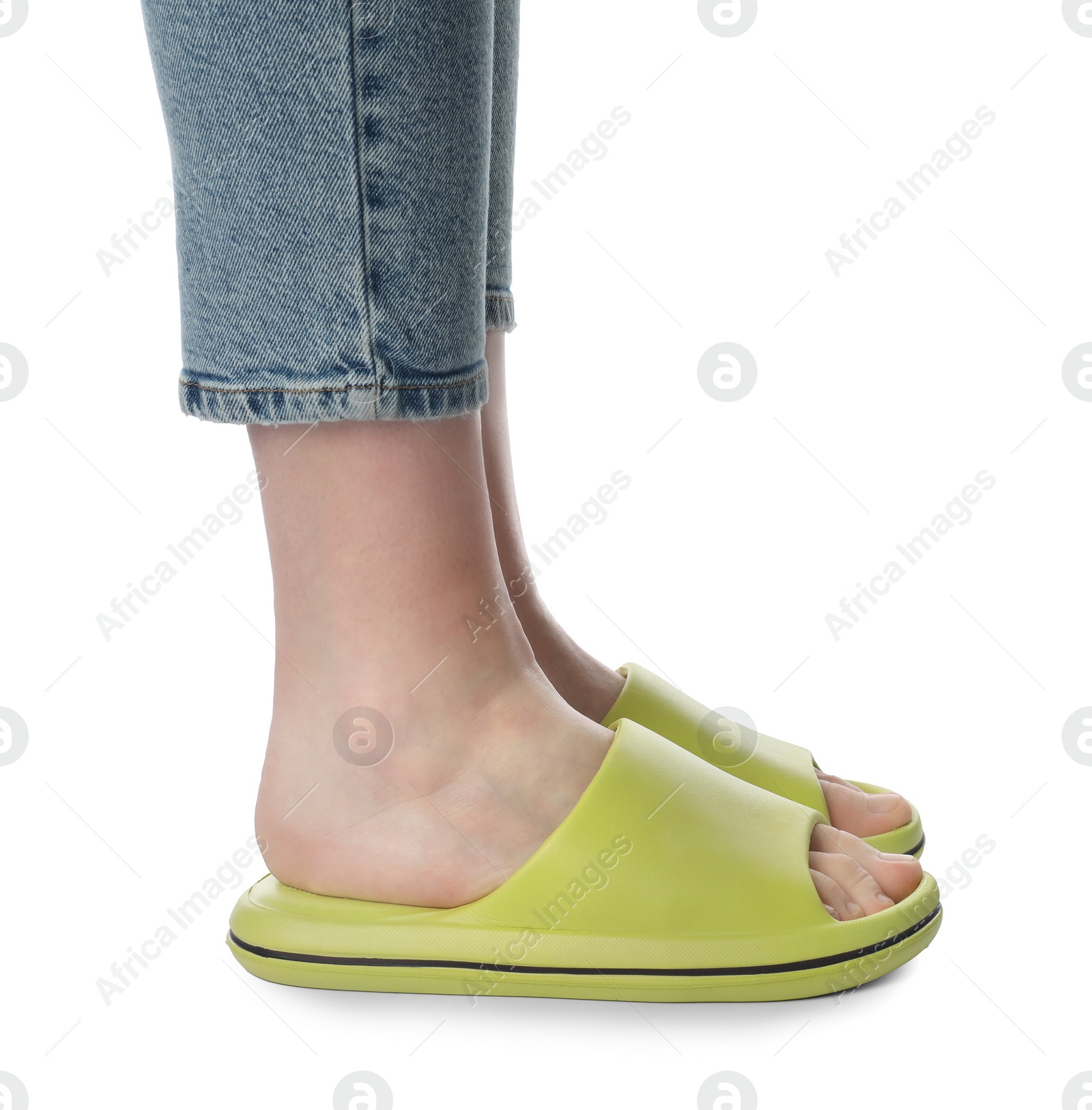 Photo of Woman in green slippers on white background, closeup