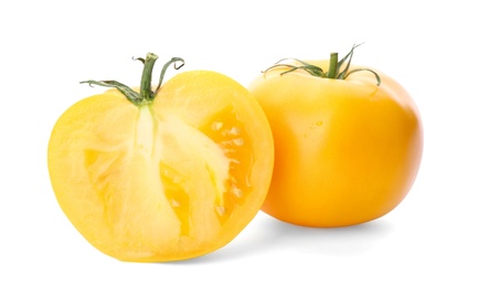 Photo of Cut ripe yellow tomatoes isolated on white