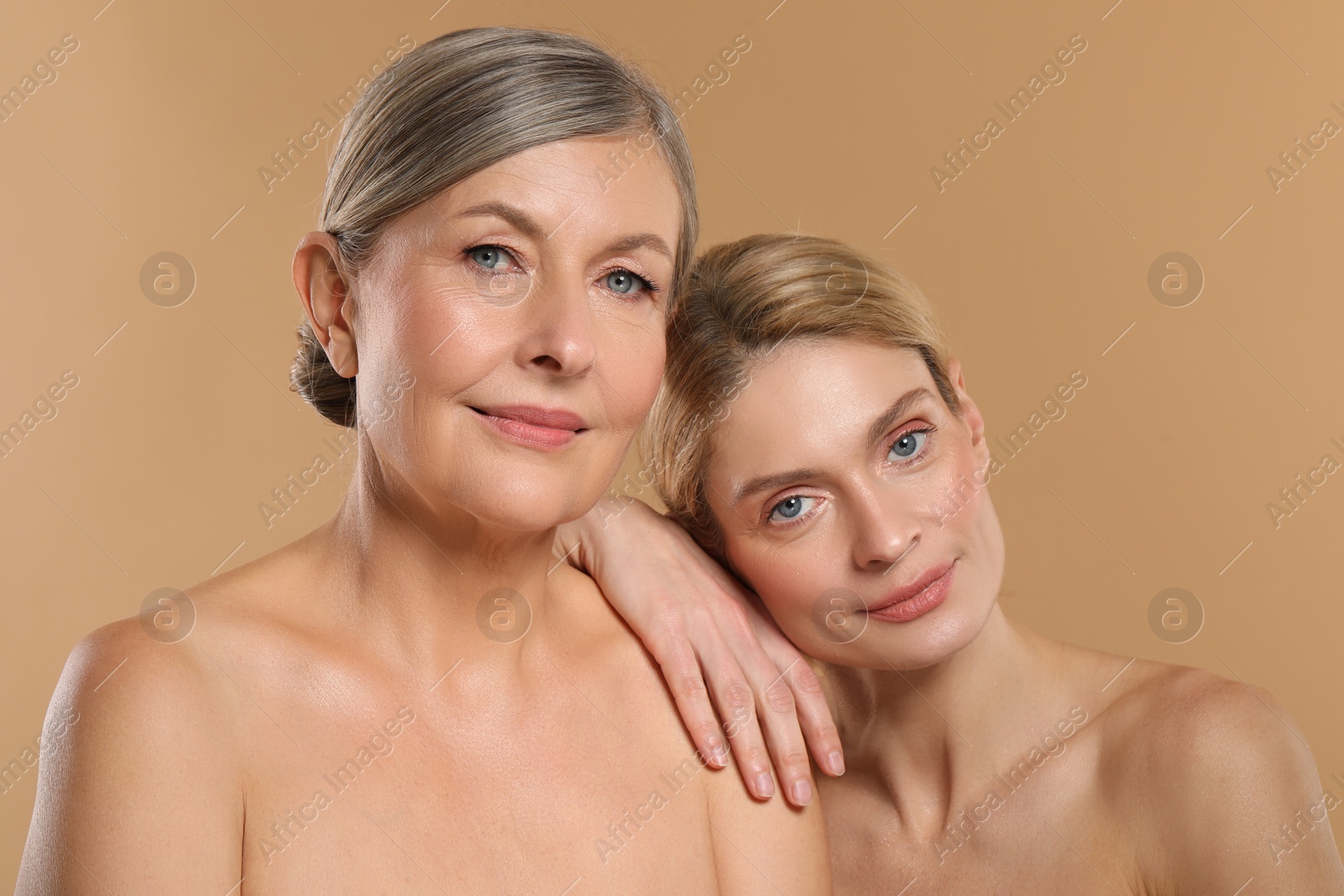 Photo of Beautiful women with healthy skin on beige background