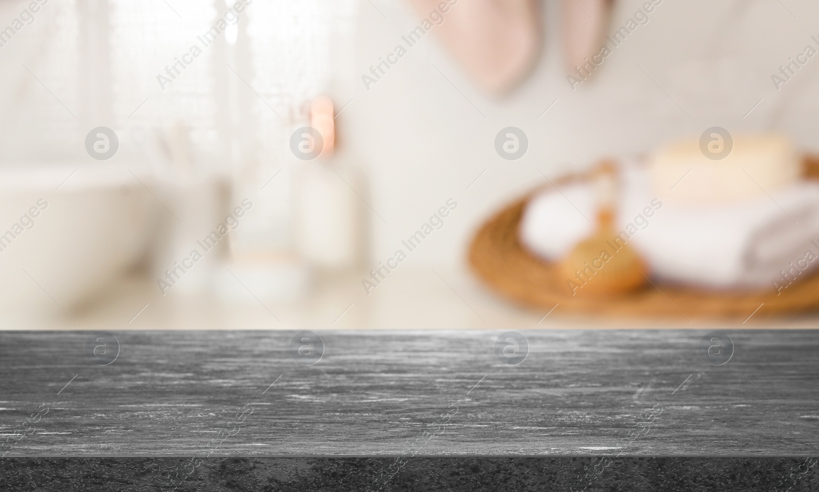 Image of Empty table and blurred view of stylish bathroom interior