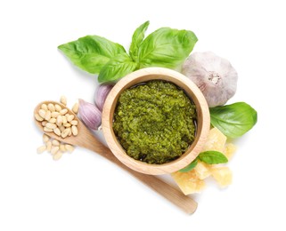 Photo of Fresh tasty pesto sauce and ingredients isolated on white, top view