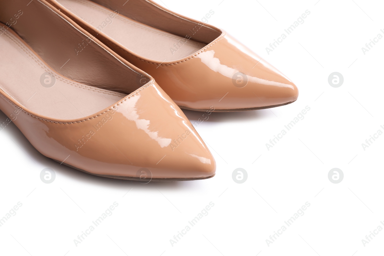 Photo of Stylish female flat shoes on white background, closeup