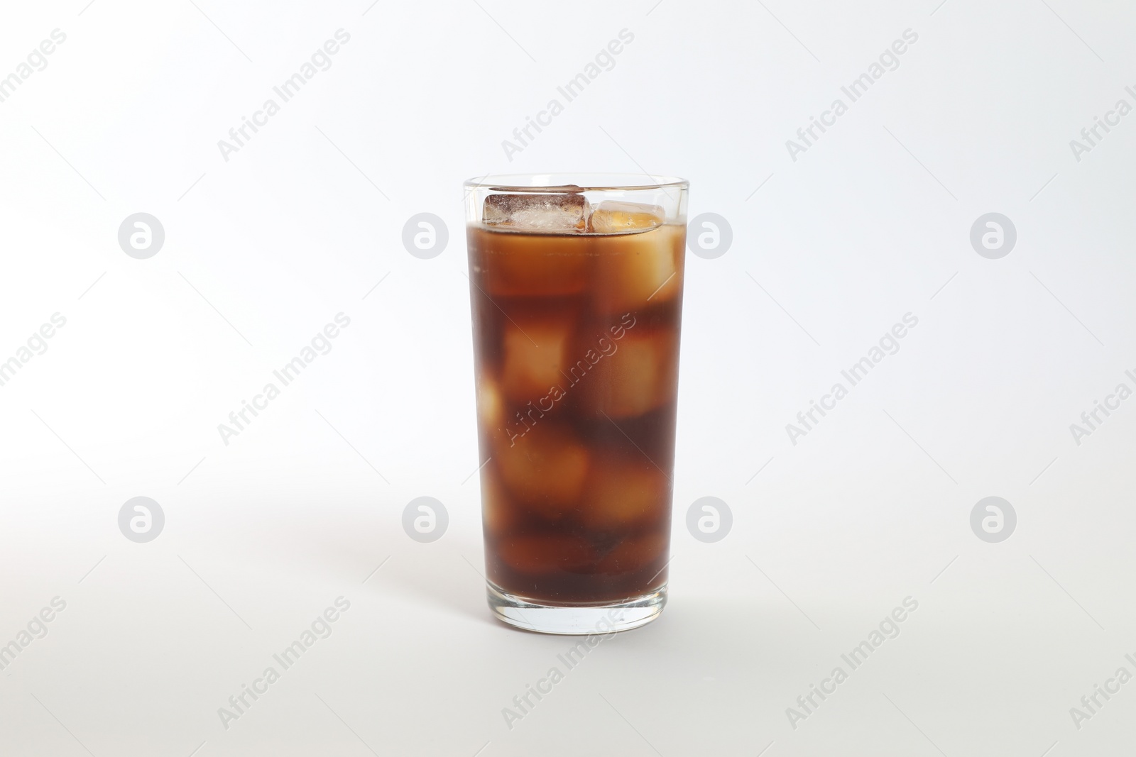 Photo of Iced coffee in glass on white background