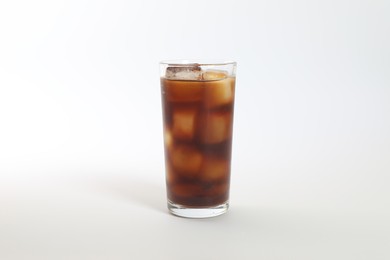 Iced coffee in glass on white background