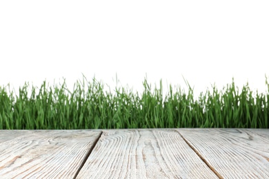 Photo of Wooden deck and green grass isolated on white