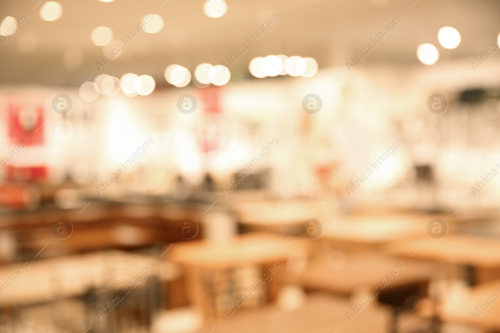 Photo of Blurred view of modern shopping mall interior