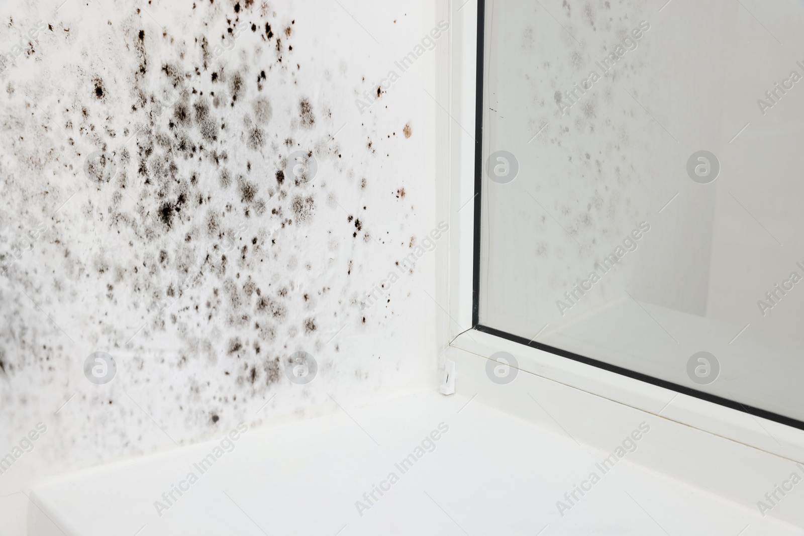 Image of Window slope affected with mold in room