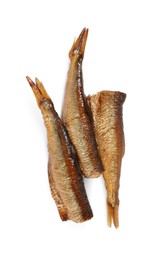 Many tasty smoked sprats isolated on white, top view