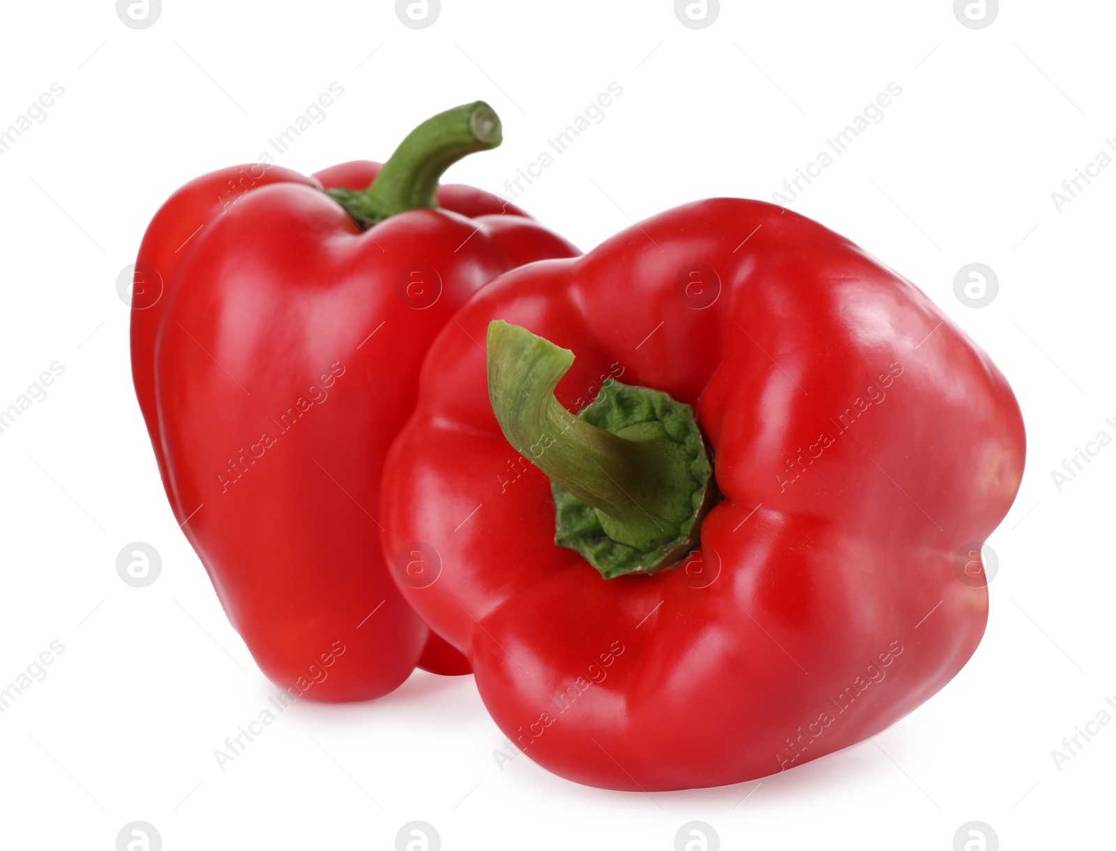 Photo of Ripe red bell peppers isolated on white