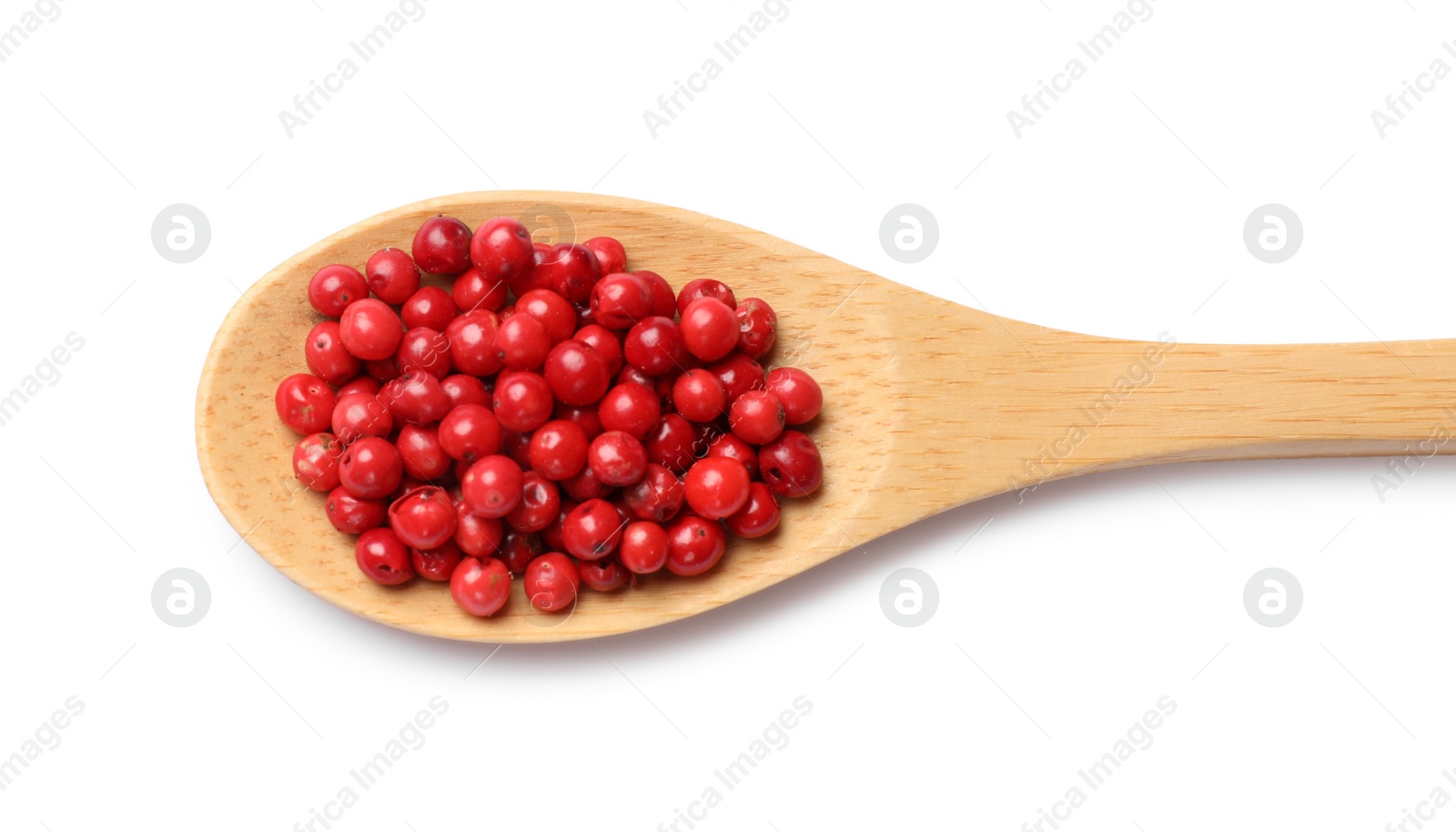 Photo of Aromatic spice. Red pepper in spoon isolated on white, top view