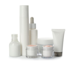 Photo of Different containers with hand cream and other cosmetic on white background