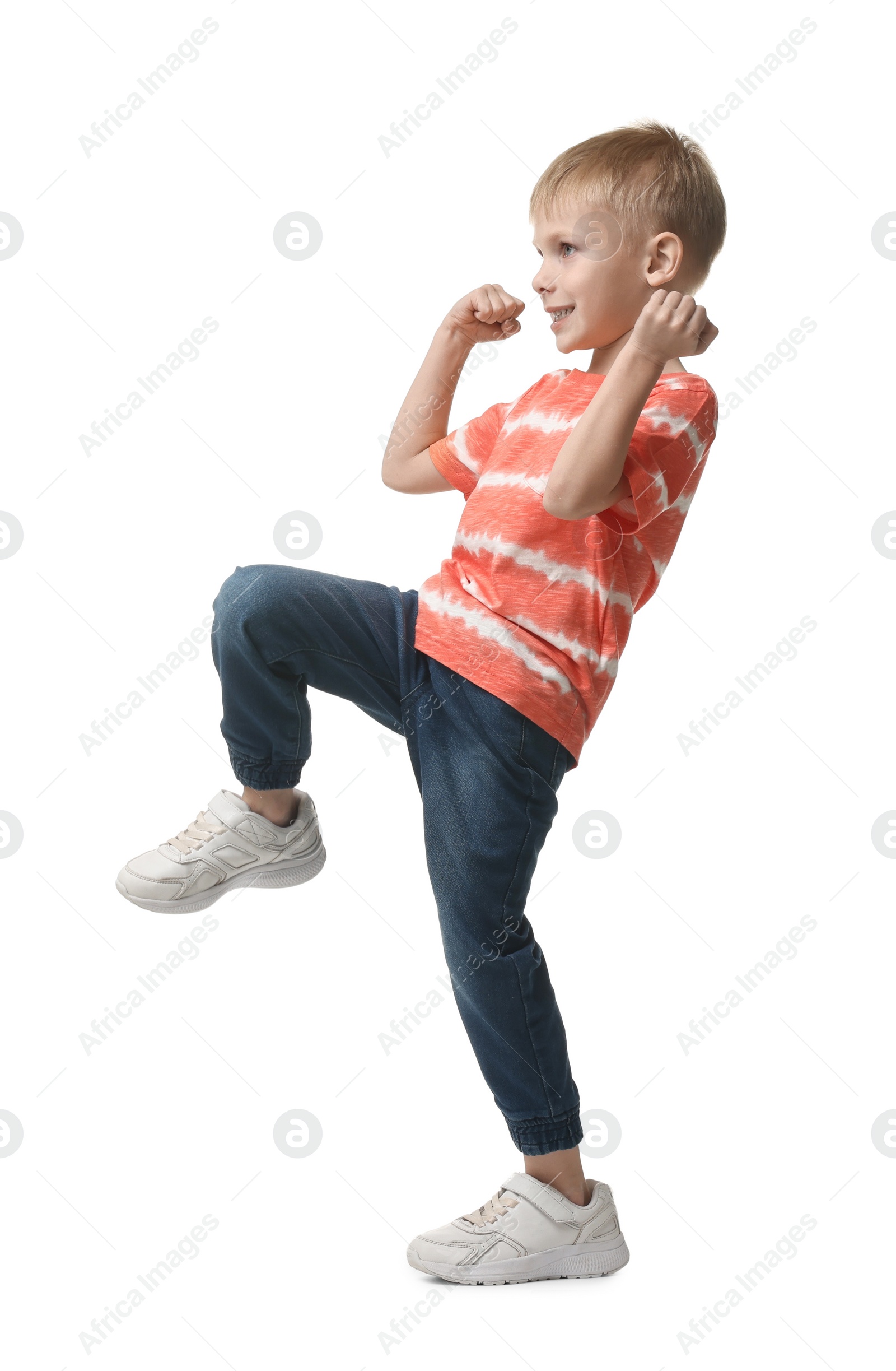 Photo of Happy little boy dancing on white background