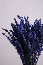 Photo of Bouquet of beautiful preserved lavender flowers on beige background, closeup