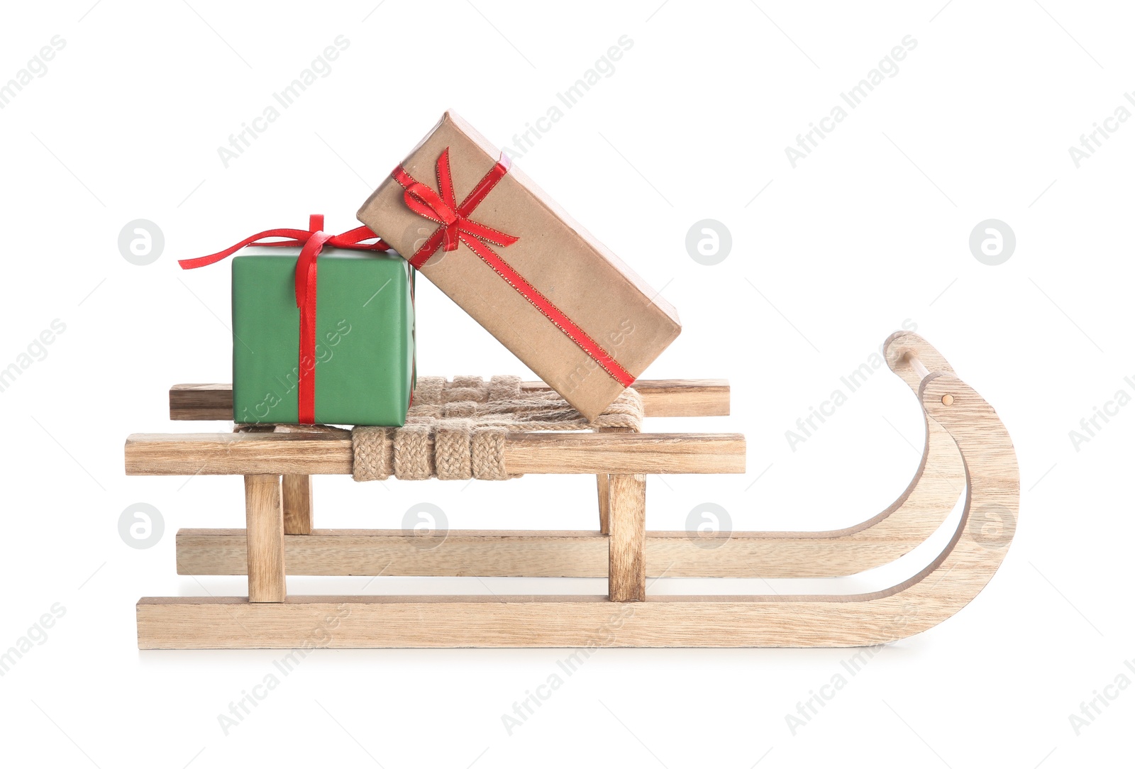 Photo of Sleigh with Christmas gifts on white background