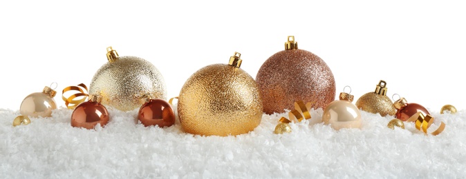 Photo of Christmas tree decoration on artificial snow against white background