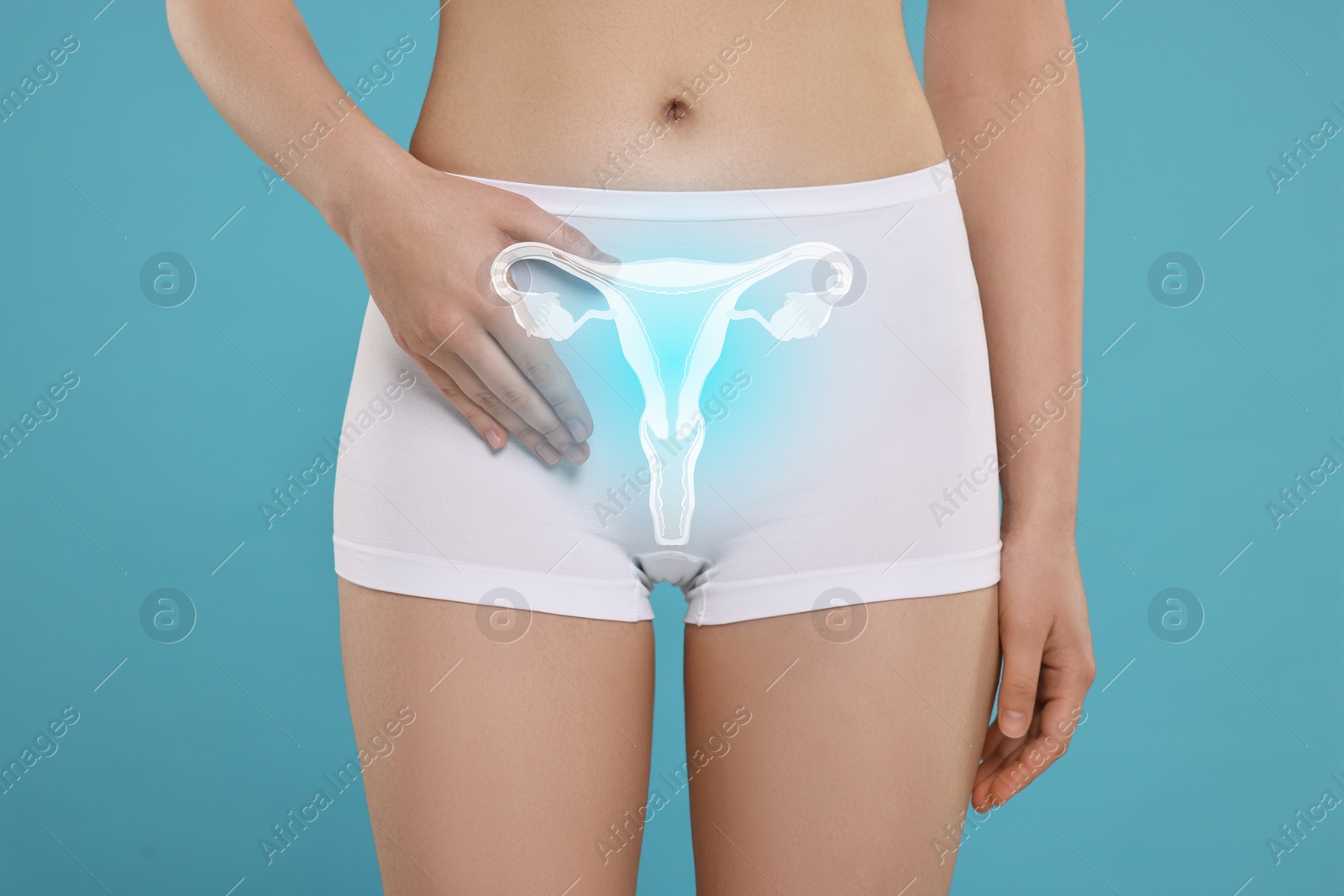 Image of Woman in underwear and illustration of reproductive system on light blue background, closeup