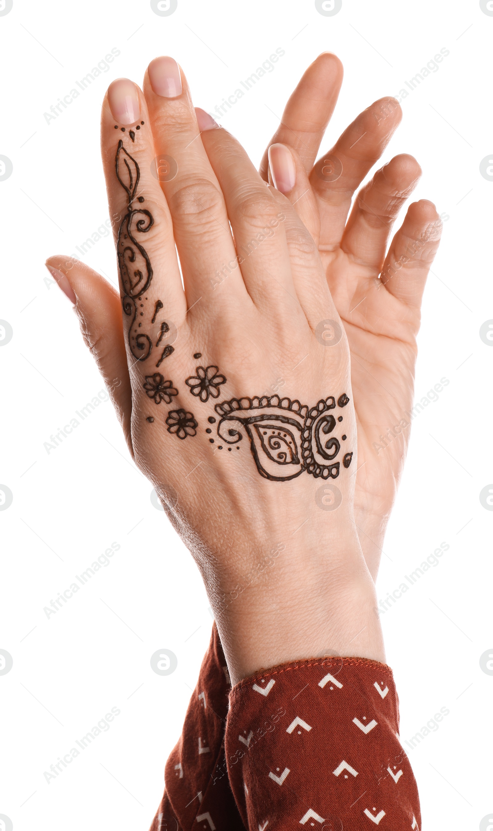 Photo of Woman with henna tattoo on hand against white background, closeup. Traditional mehndi ornament
